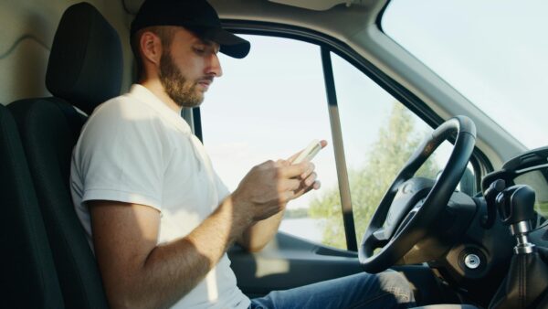 Man Using Smartphone in Vehicle | WaveBoosters UK