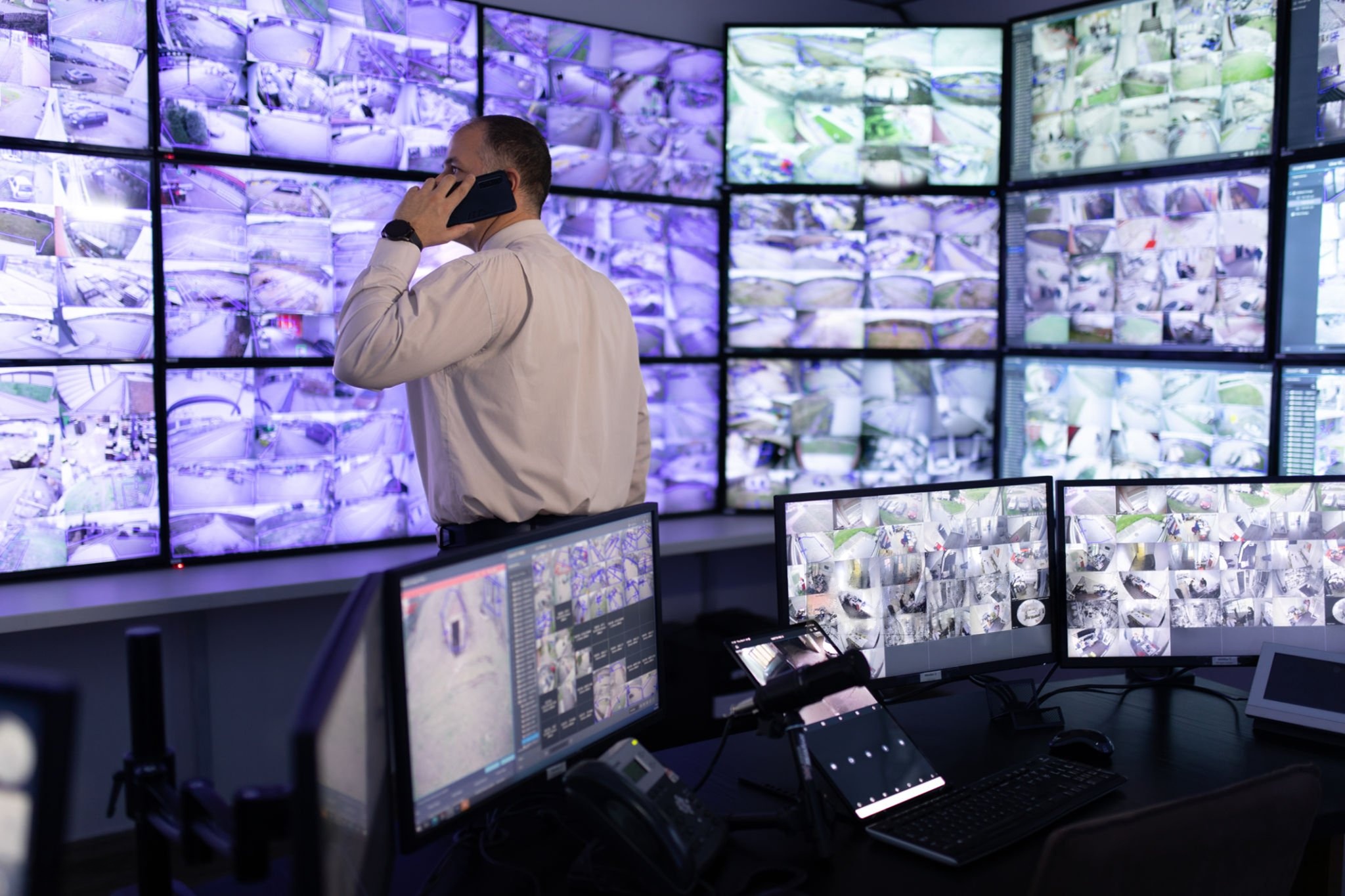 man talking in cctv control room | WaveBoosters UK